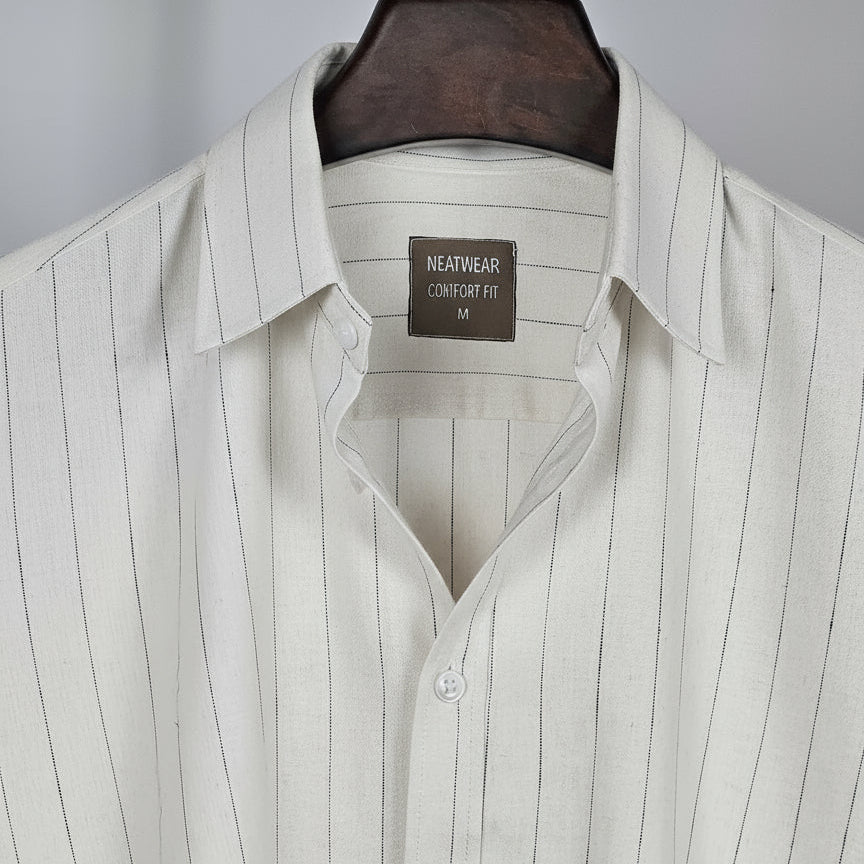 Light gray pinstripe shirt on a hanger with a visible brand label.
